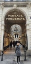 A woman photographs the entrance to the passage La Pommeraye, Nantes, France