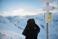 Woman photographs the sunrise on the Zawrat Pass in the Tatra Mountains in winter Royalty Free Stock Photo