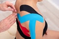 Woman With Physio Tape On Her Shoulder
