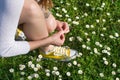 Woman picking daisies in the field Royalty Free Stock Photo