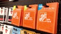 Woman picking the homedepot gift card