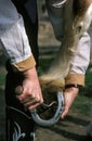 Woman Picking out Horse foot