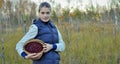 Woman picking ripe cranberies Royalty Free Stock Photo