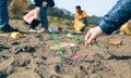 Woman picking up straws on the beach Royalty Free Stock Photo