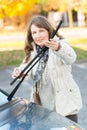 Woman picking up windscreen wiper