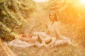 Woman picnic vineyard. Romantic dinner, fruit and wine. Happy woman with a glass of wine at a picnic in the vineyard on