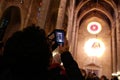 A woman pictures with her mobile phone the 8 of the Palma de Mallorca cathedral