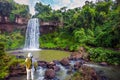 Woman pictures waterfall Iguazu Falls. Royalty Free Stock Photo