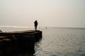 the woman on the pier looks beautiful Royalty Free Stock Photo