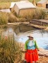 Woman on pier in Reed Islands on Lake Titicaca, 6/13/13