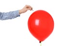 Woman piercing red balloon on white background