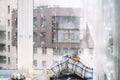 Woman in pijamas sitting on windowsill with a cup of coffee. Winter mood. Royalty Free Stock Photo