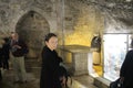 Woman pilgrim in The Church of the Holy Sepulchre, Christ`s tomb, in the Old City of Jerusalem, Israel Royalty Free Stock Photo
