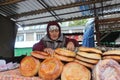 Woman piling breads