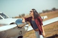 Woman pilot and private business airplane Royalty Free Stock Photo