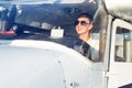 Woman Pilot Sitting in Cabin of Modern Aircraft.