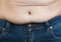Woman pinching fat from her abdomen Royalty Free Stock Photo
