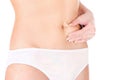 Woman pinching stomach for skin fold test Royalty Free Stock Photo