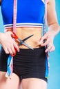 Woman pinching waist for skin fold test