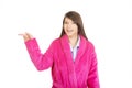 Woman in pink bathrobe pointing aside. Royalty Free Stock Photo