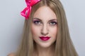 Woman with pink bow Royalty Free Stock Photo