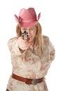 Woman with pink cowboy hat pointing pistol Royalty Free Stock Photo
