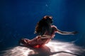 Woman Pink Dress Swimming Dark Underwater Pool Royalty Free Stock Photo