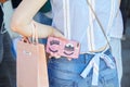 Woman with pink glitter Chiara Ferragni phone cover and Miu Miu shopper before Alberta Ferretti fashion show,