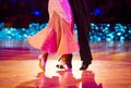 Woman in pink gown and man black tailcoat. Latino dancing