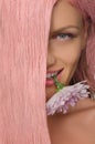 Woman with pink hair and flower in his teeth Royalty Free Stock Photo