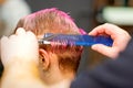 Woman with pink hair getting short haircut Royalty Free Stock Photo