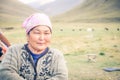 Woman with pink headcloth in Kyrgyzstan Royalty Free Stock Photo