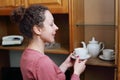 A woman in a pink holding cup and Royalty Free Stock Photo