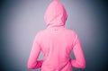 Woman in pink jacket with hood