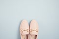 Woman pink pastel shoes over blue background. Fashion blog, sprind and summer urban style, online shpping. Minimal flat lay, top