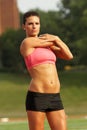 Woman in Pink Sports Bra Stretching Triceps