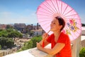 Woman with pink umbrella looks at Rom Royalty Free Stock Photo