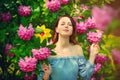 Woman with pinwheel in blossom garden Royalty Free Stock Photo