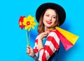 Woman with pinwheel and shopping bags Royalty Free Stock Photo