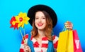 Woman with pinwheel and shopping bags Royalty Free Stock Photo