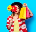 Woman with pinwheel and shopping bags Royalty Free Stock Photo