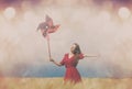 Woman with Pinwheel toy on field Royalty Free Stock Photo