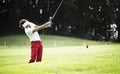 Woman pitching at golf course. Royalty Free Stock Photo