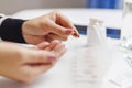 The woman places pills in an open pill organizer or plastic pill box Royalty Free Stock Photo