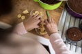 Woman placing sliced banana in a glass bowl Royalty Free Stock Photo