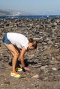 Woman placing stones