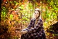 Woman in plaid dress in autumn forest. nature walks.