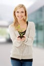 Woman with plant and soil in hand