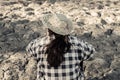 Woman planted a tree on a drought-stricken land. Royalty Free Stock Photo