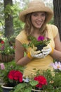 Woman planting flowers in her garden